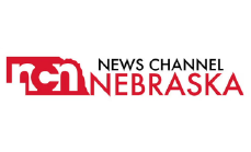 Logo of News Channel Nebraska with red and black text on a white background